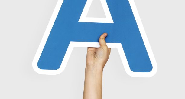 Hands holding the letter A